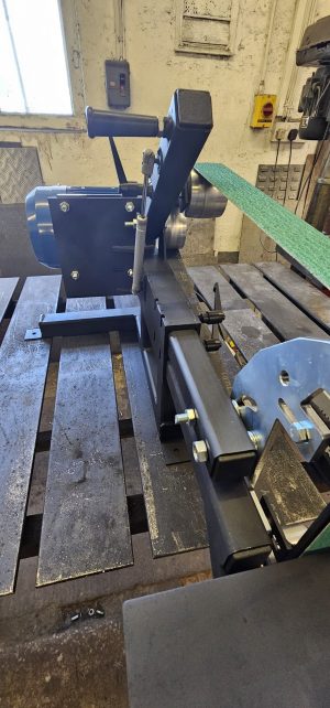 Adjustable belt tension on 72in belt grinder