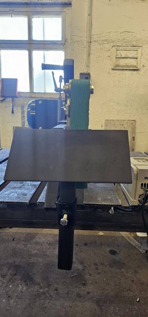 knife making platen tilted on a 2x72in grinder